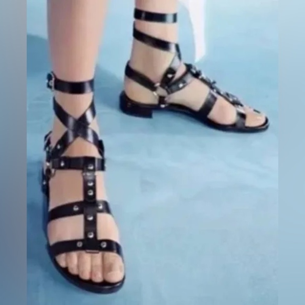 Stuart Weitzman “On the Run” Black Studded Leather Strappy Sandals